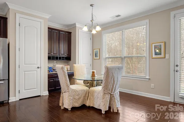 a dining room with furniture window wooden floor
