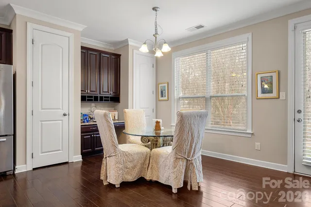 a dining room with furniture window wooden floor