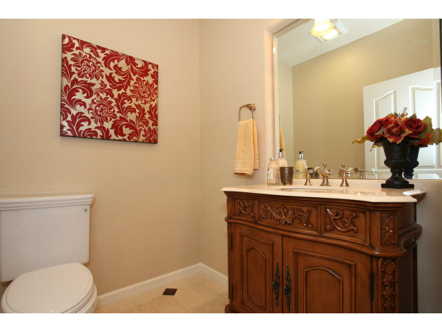 5504 Perugia Circle San Jose, CA 95138 - Photo 13 of 25 a bathroom with a sink mirror vanity and toilet