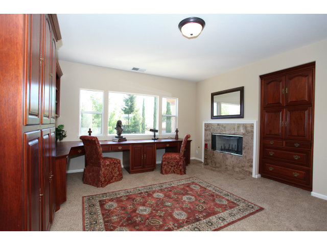 5504 Perugia Circle San Jose, CA 95138 - Photo 16 of 25 a living room with furniture a window and a fireplace