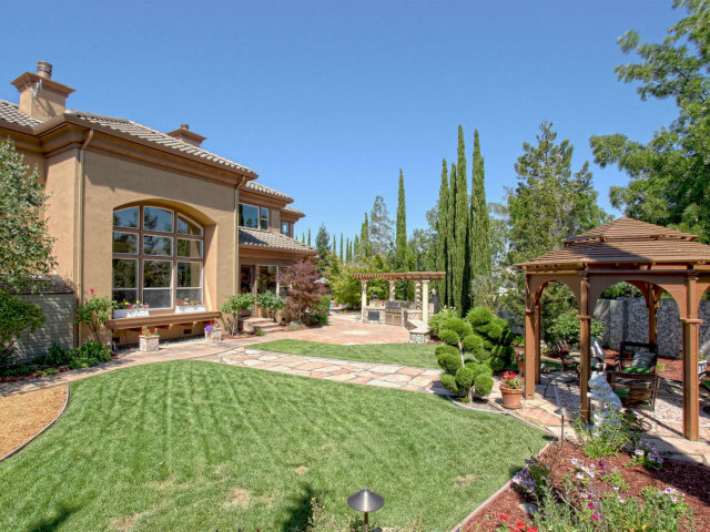 5504 Perugia Circle San Jose, CA 95138 - Photo 19 of 25 a front view of a house with garden and porch