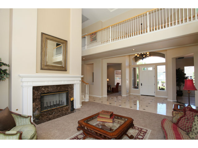 5504 Perugia Circle San Jose, CA 95138 - Photo 4 of 25 a living room with furniture a fireplace and a flat screen tv