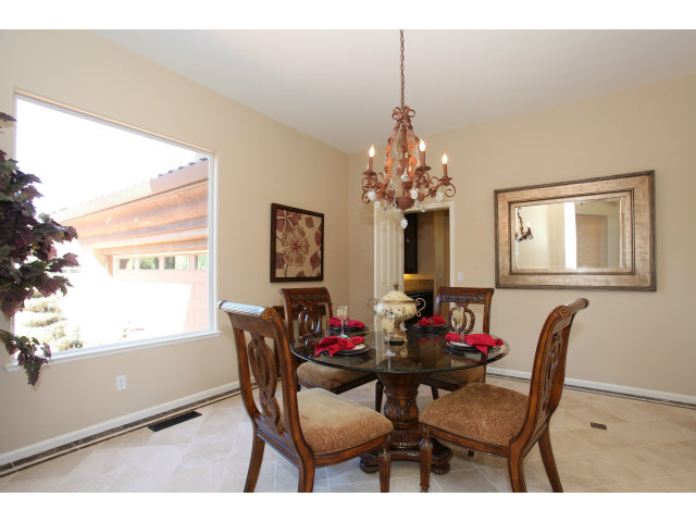 5504 Perugia Circle San Jose, CA 95138 - Photo 5 of 25 a dining room with furniture a chandelier and window