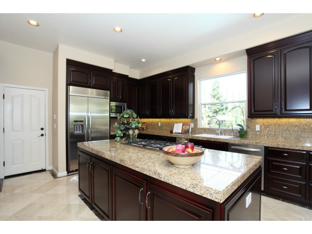 5504 Perugia Circle San Jose, CA 95138 - Photo 6 of 25 a kitchen with granite countertop a sink cabinets and window