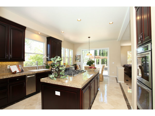 5504 Perugia Circle San Jose, CA 95138 - Photo 7 of 25 a kitchen with a sink refrigerator and microwave