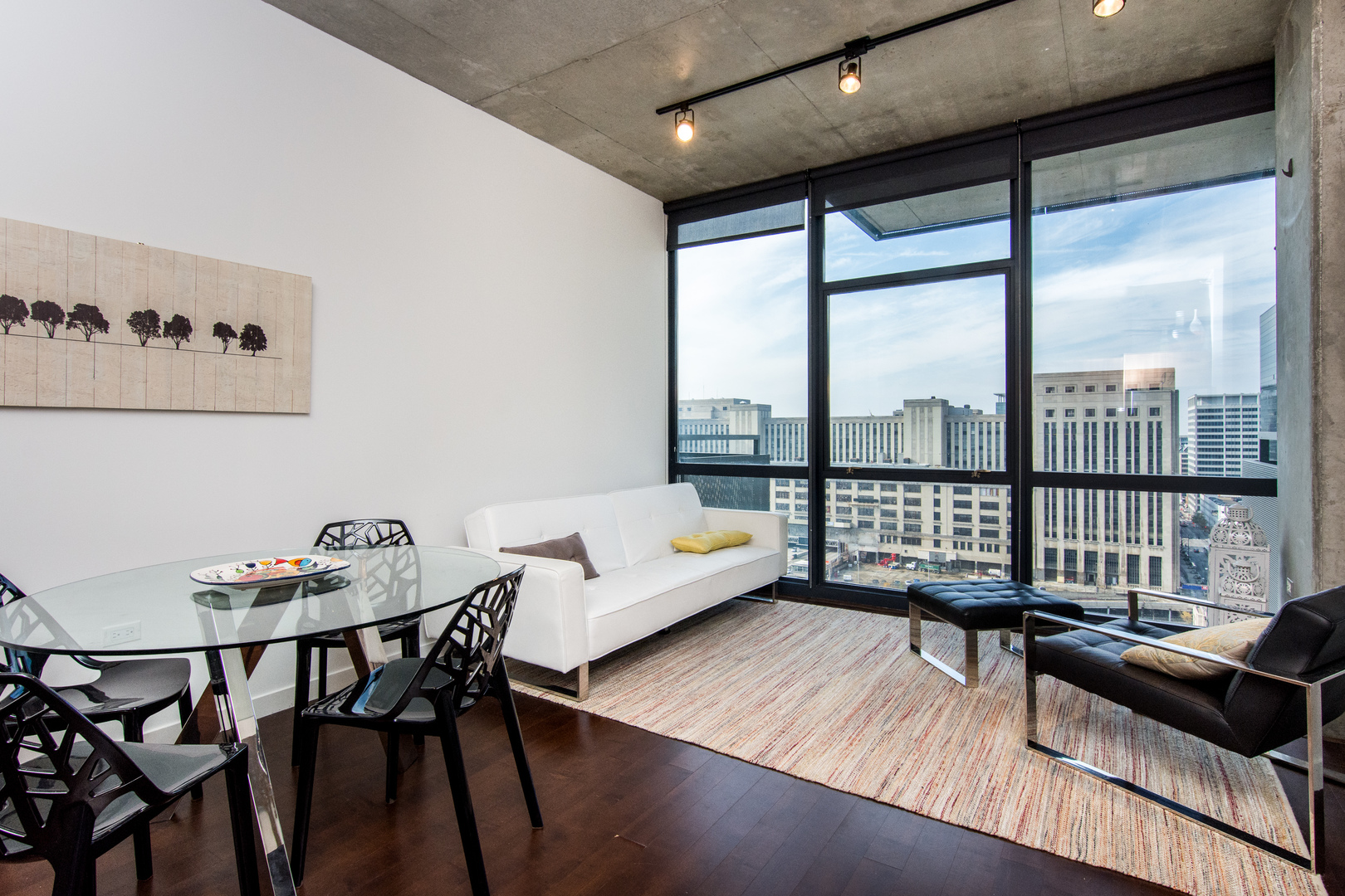 235 West Van Buren Street, Unit 1913 Chicago, IL 60607 - Photo 3 of 13 a living room with furniture and a floor to ceiling window