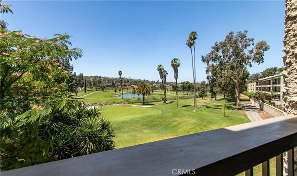 a view of a swimming pool with an outdoor space and seating area
