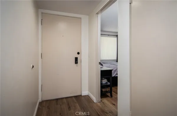 a view of a room with wooden floor and closet