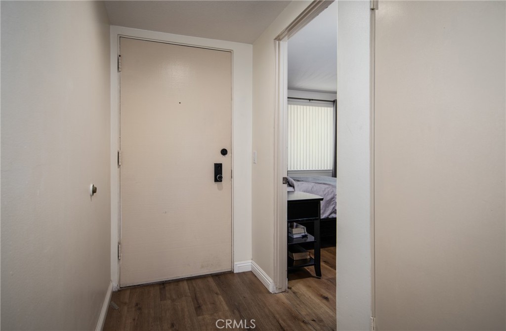 5555 Canyon Crest Drive, Unit 2G Riverside, CA 92507 - Photo 13 of 24 a view of a room with wooden floor and closet