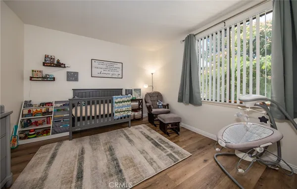 a bed room with a bed and a chair