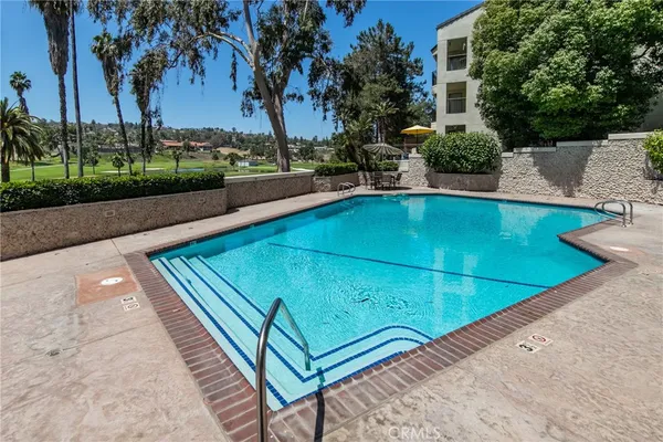 a view of a pool with a patio