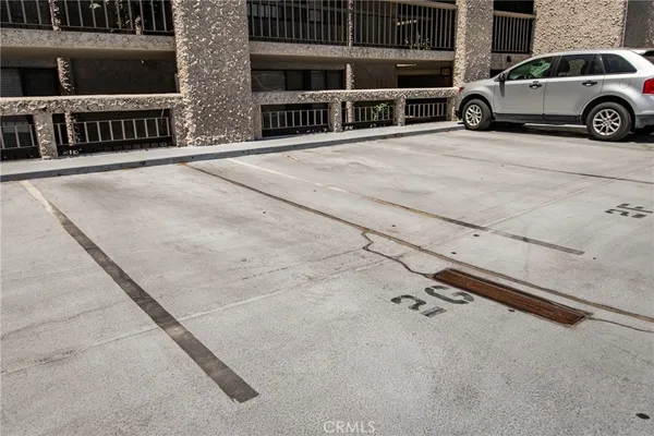 a view of a car parked in front of a building