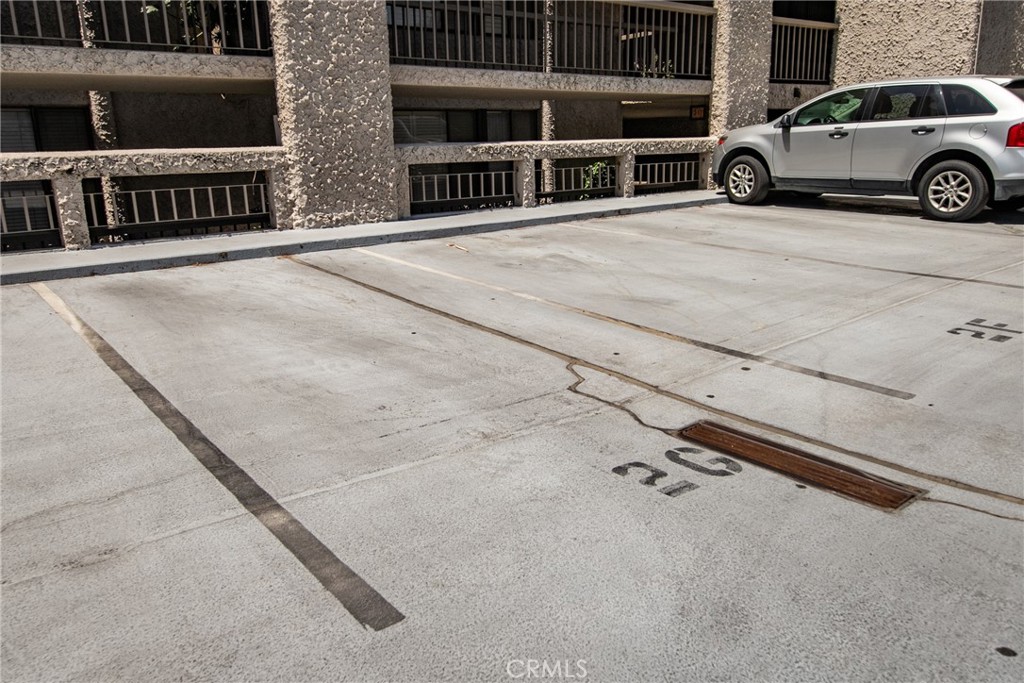 5555 Canyon Crest Drive, Unit 2G Riverside, CA 92507 - Photo 24 of 24 a view of a car parked in front of a building