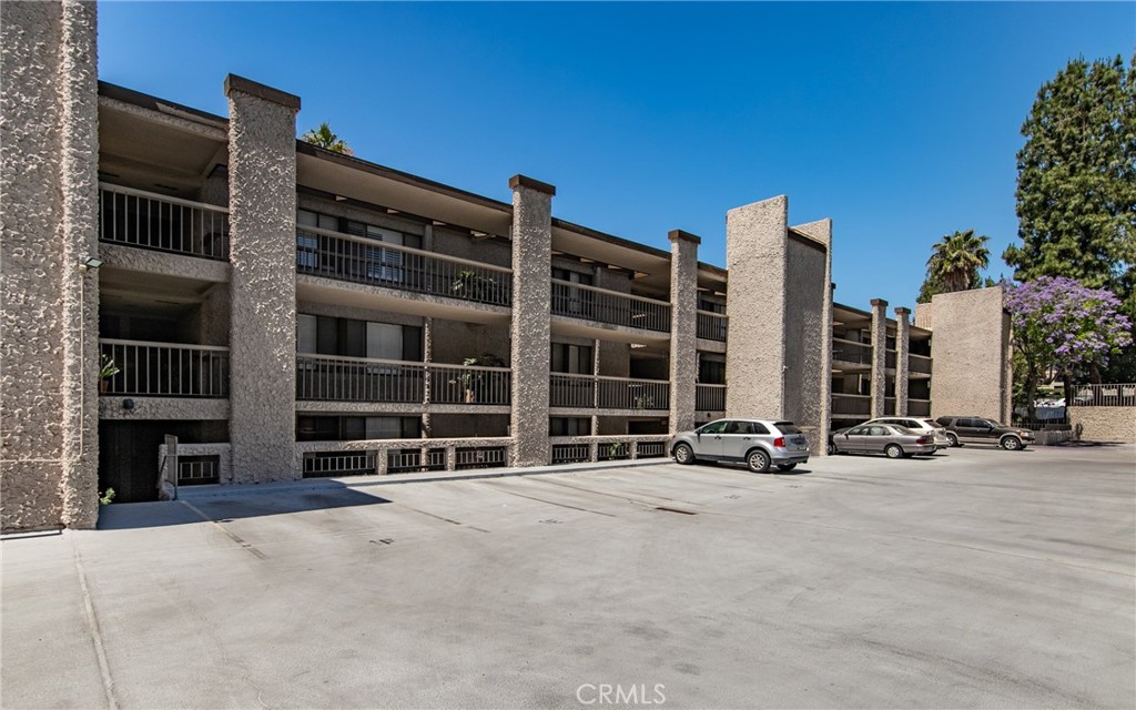 5555 Canyon Crest Drive, Unit 2G Riverside, CA 92507 - Photo 5 of 24 front view of house with a street