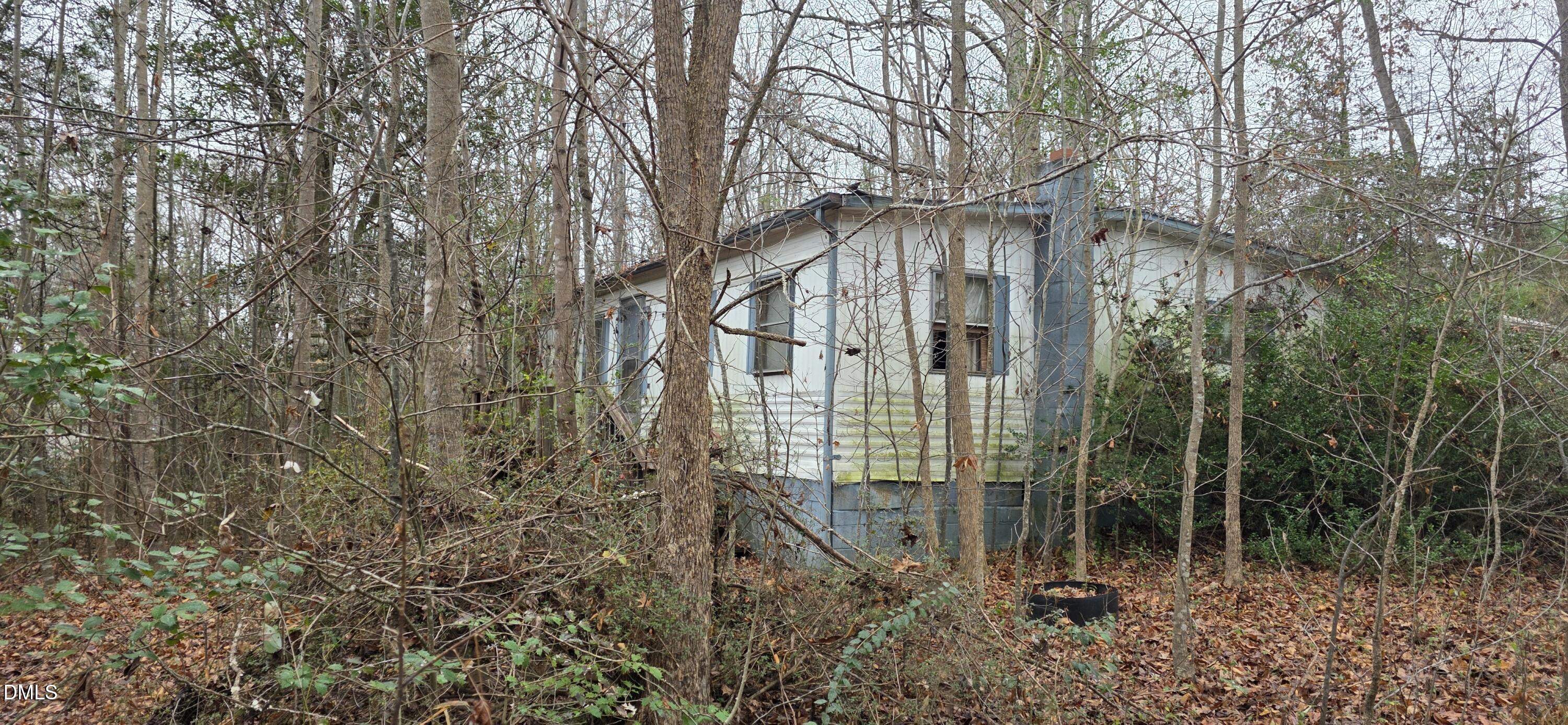 674 Axtell Ridgeway Road Norlina, NC 27563 - Photo 4 of 7 a view of a house with a yard