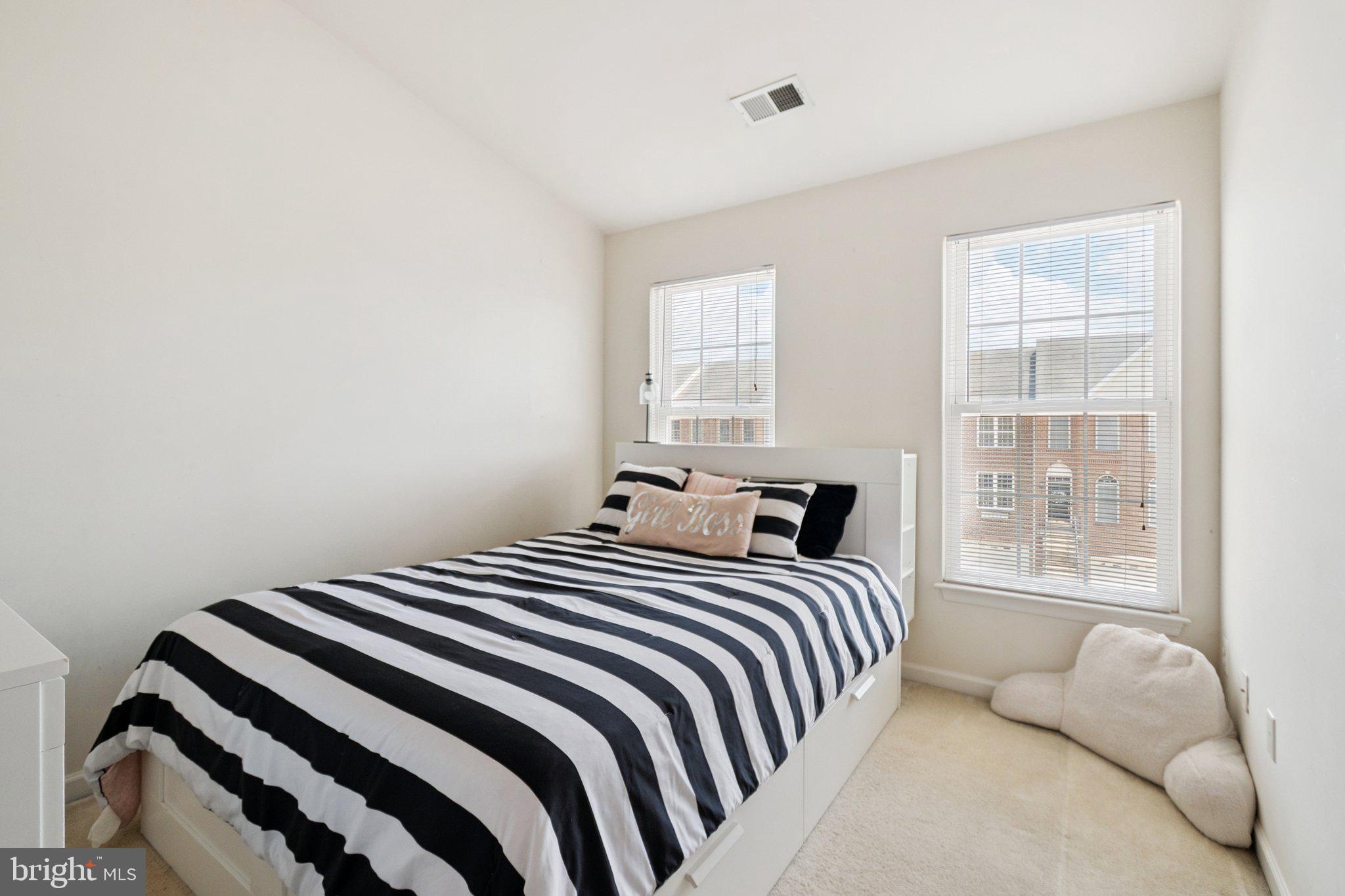 22602 Welborne Manor Square Ashburn, VA 20148 - Photo 11 of 30 a bedroom with a bed and a window