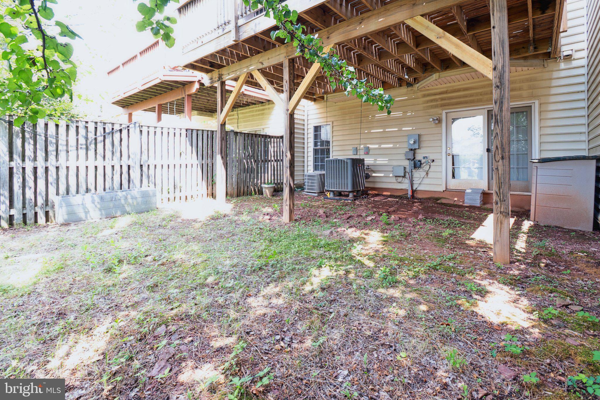 22602 Welborne Manor Square Ashburn, VA 20148 - Photo 23 of 30 a view of a backyard with a small cabin