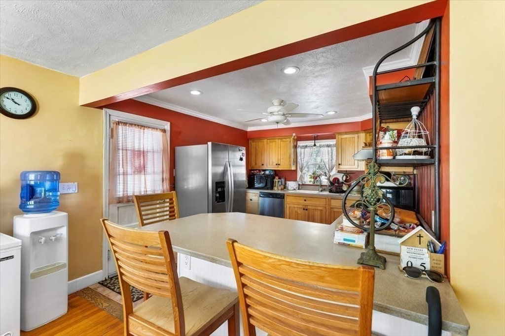 210 Harrison Avenue Somerset, MA 02726 - Photo 10 of 29 a dining room with furniture and a floor to ceiling window
