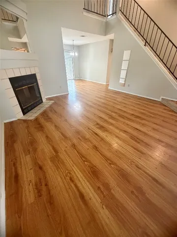 a view of a livingroom with wooden floor