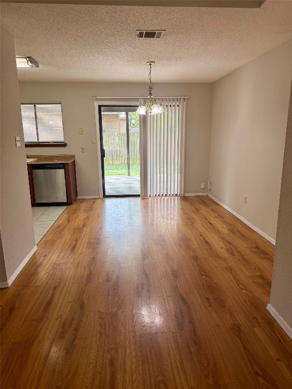 1707 Honeysuckle Lane Round Rock, TX 78664 - Photo 6 of 21 an empty room with wooden floor and windows
