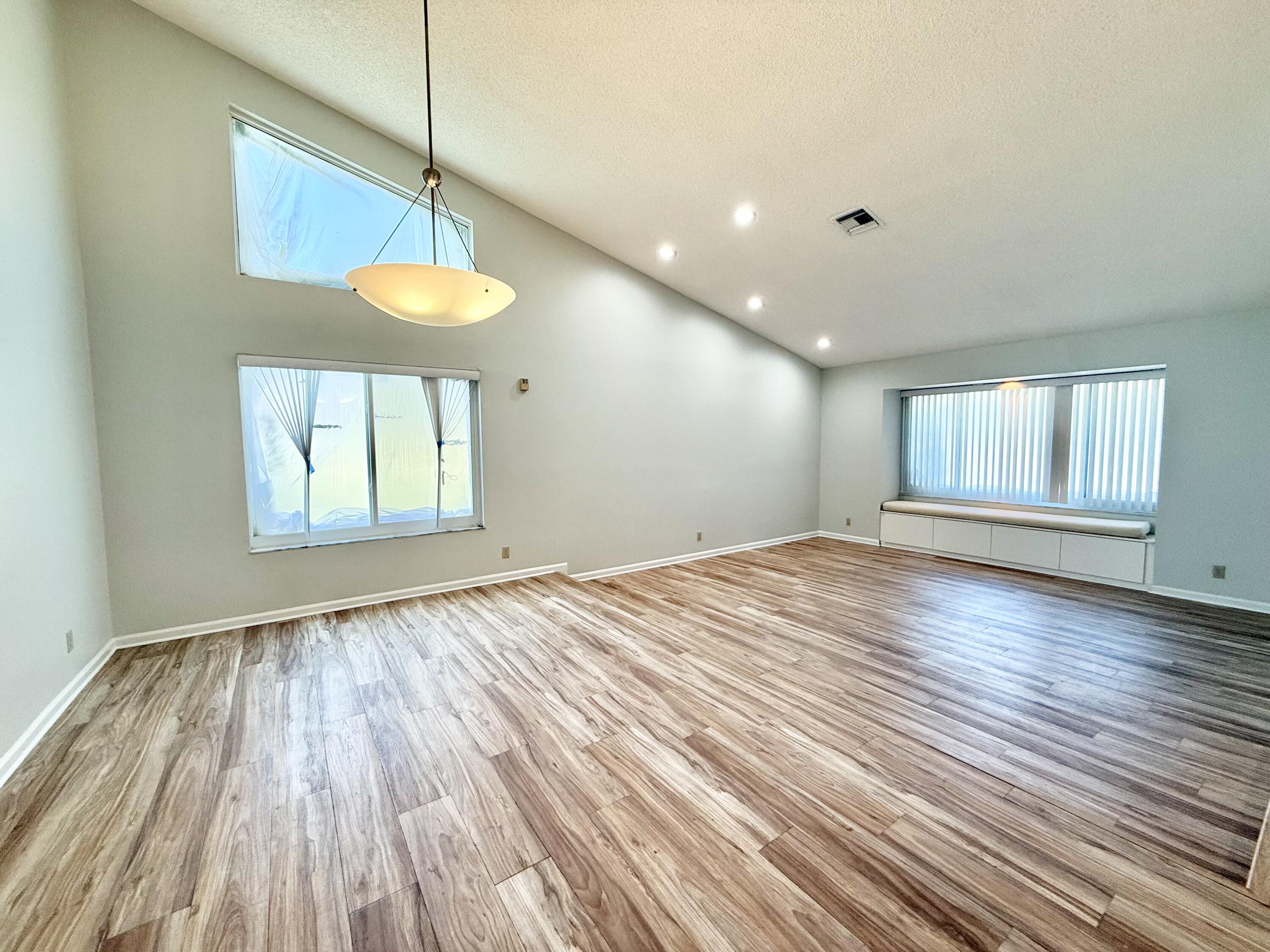 11933 Waterwood Drive Boca Raton, FL 33428 - Photo 5 of 51 LIVING ROOM + DINING ROOM