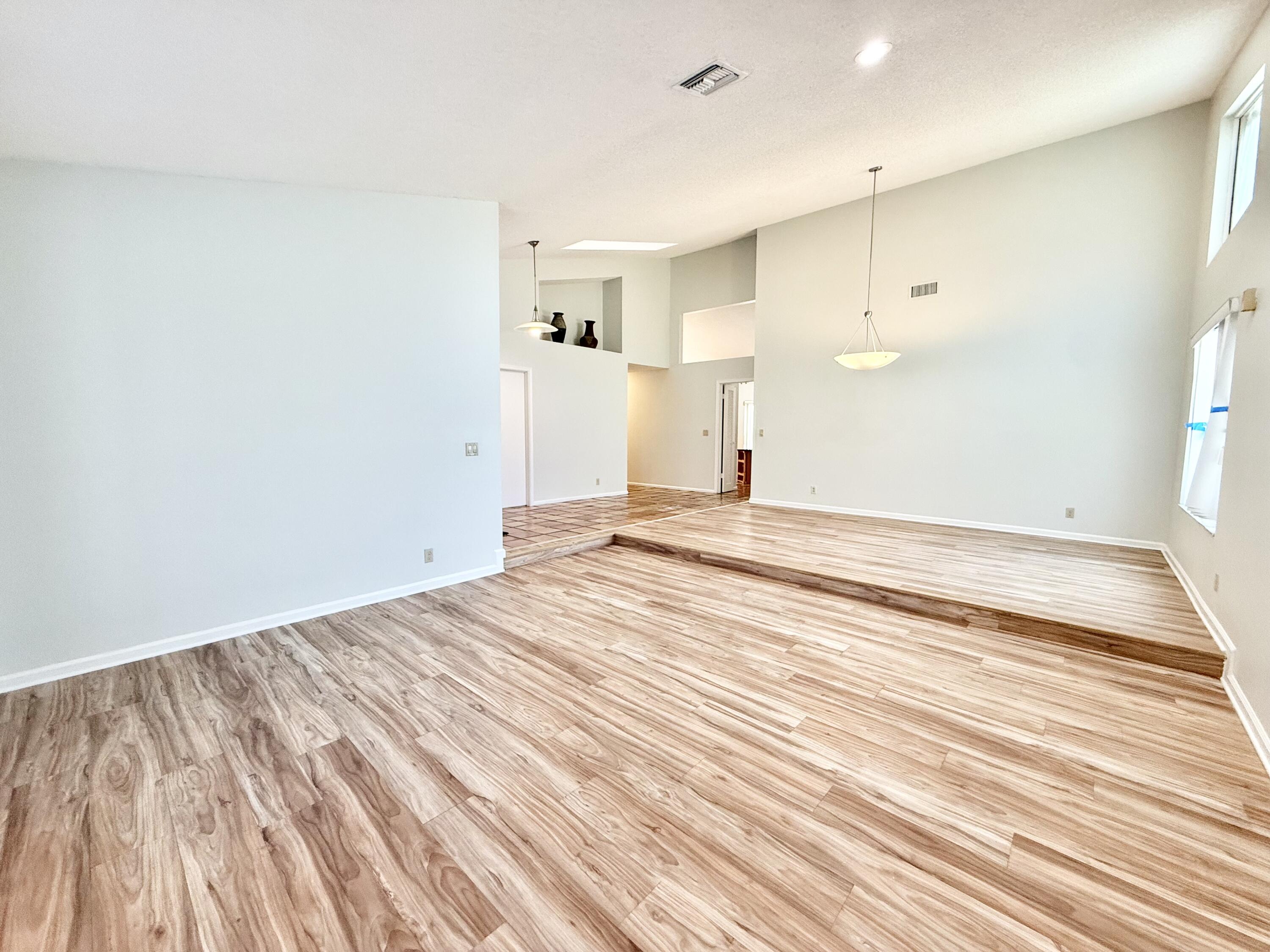 11933 Waterwood Drive Boca Raton, FL 33428 - Photo 6 of 51 LIVING ROOM + DINING ROOM