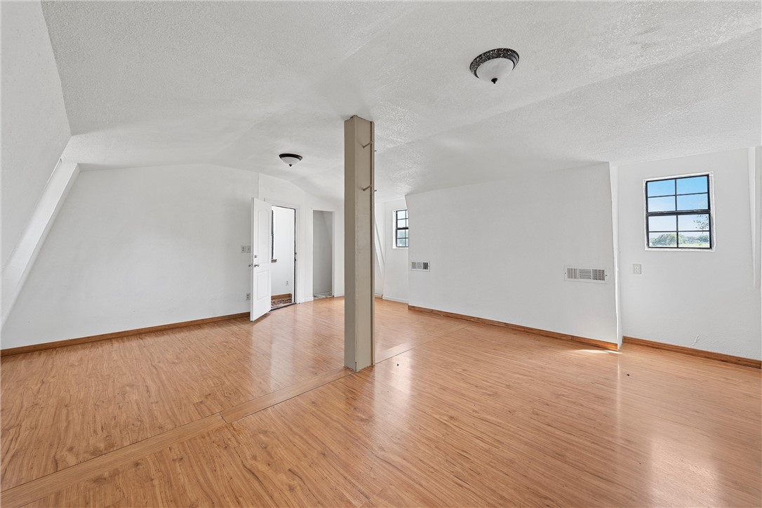 821 Old Country Road Moody, TX 76557 - Photo 11 of 21 a view of an empty room with wooden floor and a window