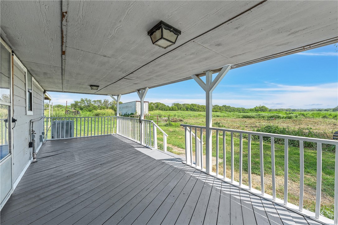 821 Old Country Road Moody, TX 76557 - Photo 14 of 21 a view of a balcony with wooden floor