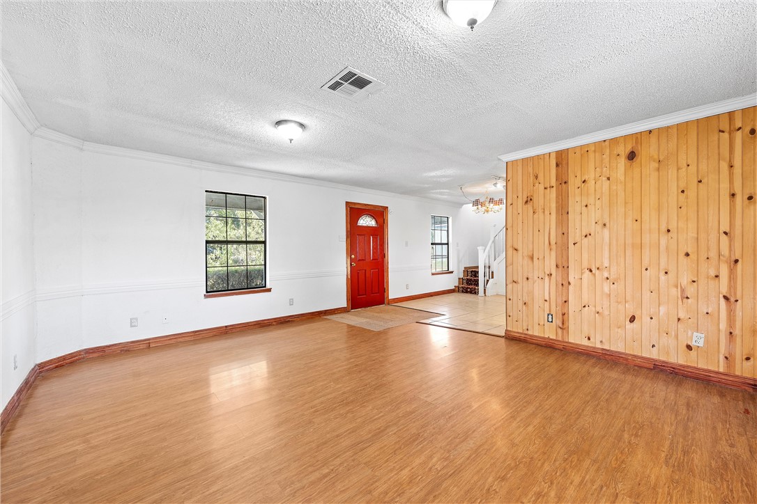 821 Old Country Road Moody, TX 76557 - Photo 5 of 21 an empty room with wooden floor and natural light