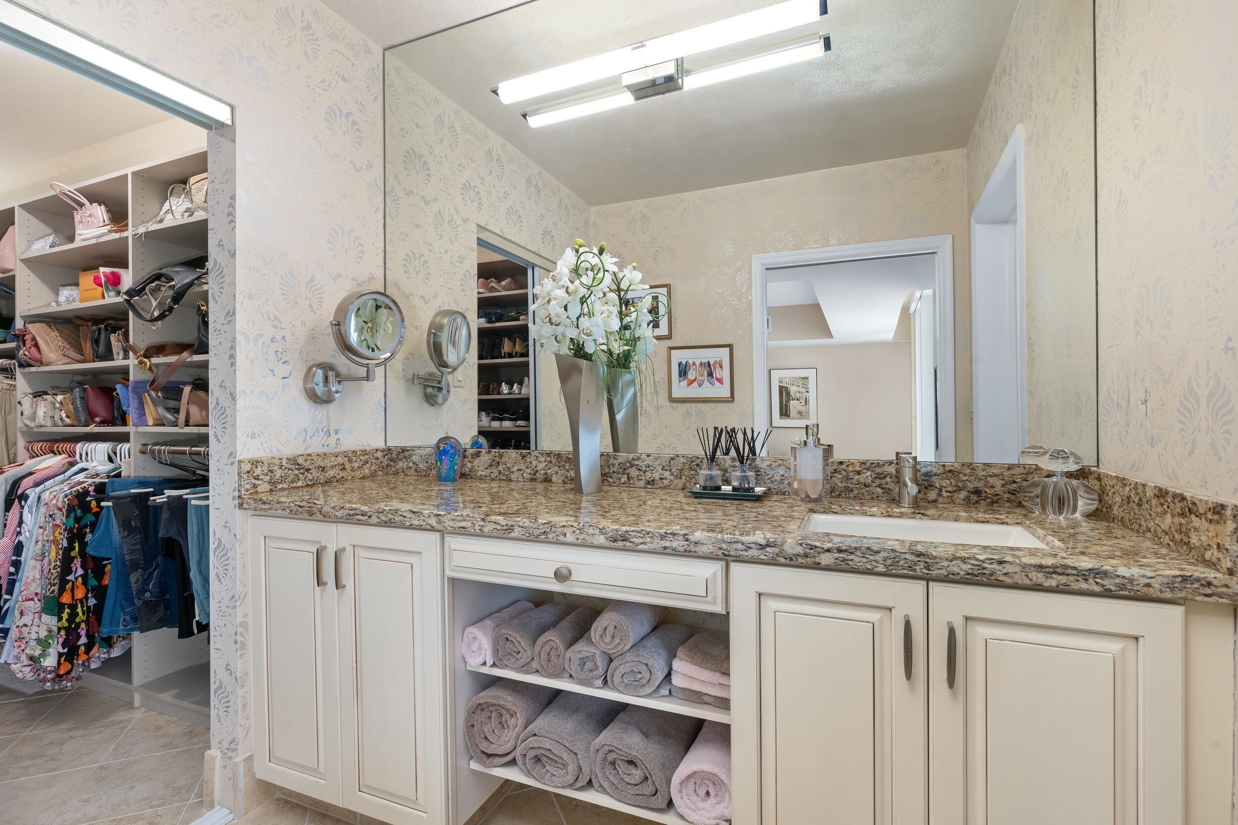 100 Southeast 5th Avenue, Unit 207 Boca Raton, FL 33432 - Photo 23 of 46 a bathroom with a granite countertop sink and a mirror