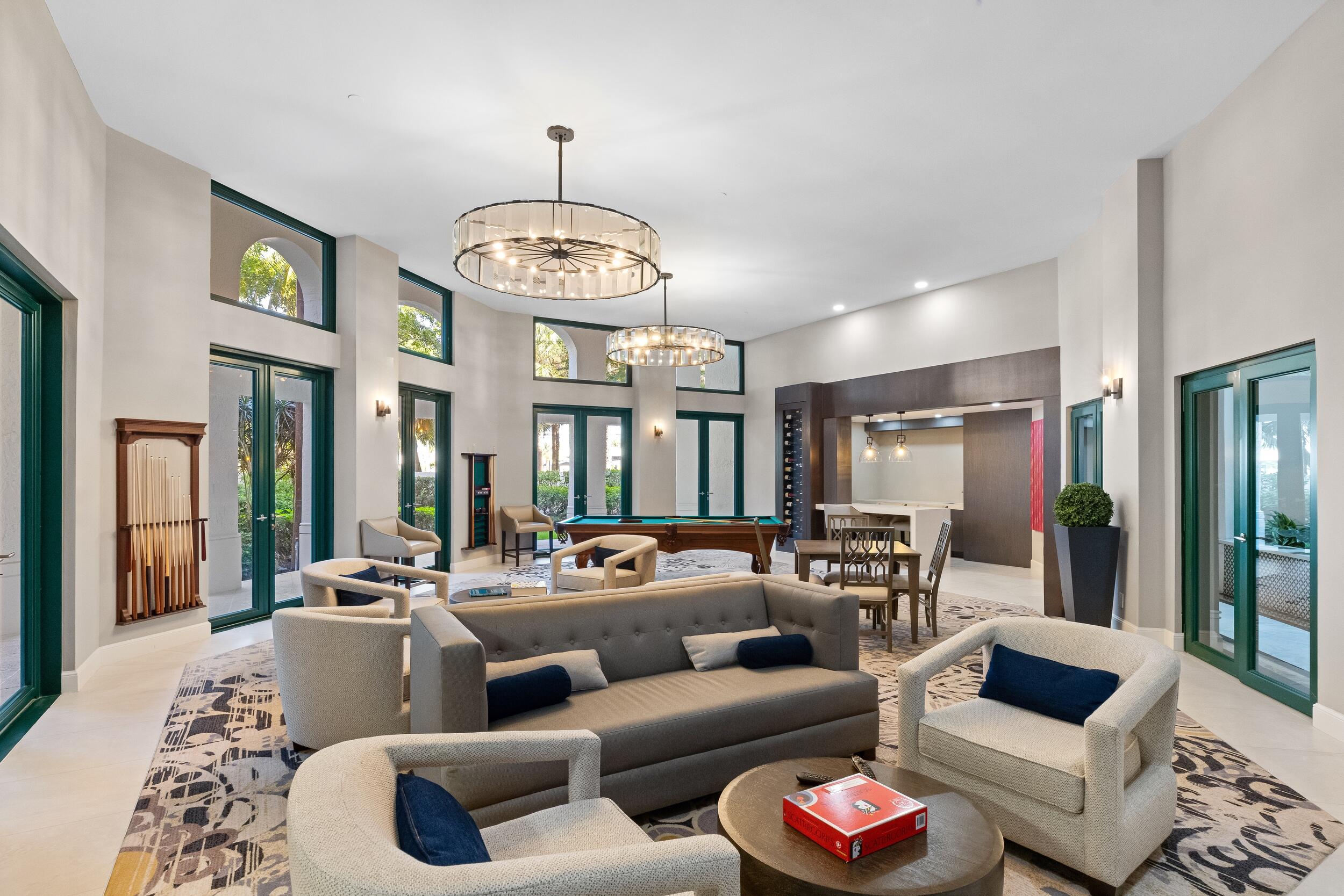 100 Southeast 5th Avenue, Unit 207 Boca Raton, FL 33432 - Photo 31 of 46 a living room with furniture chandelier and a large window