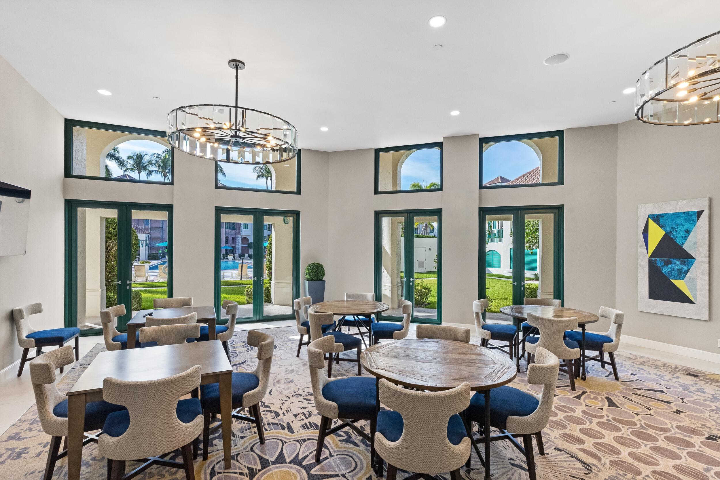 100 Southeast 5th Avenue, Unit 207 Boca Raton, FL 33432 - Photo 34 of 46 a view of a dining room with furniture a chandelier and a window