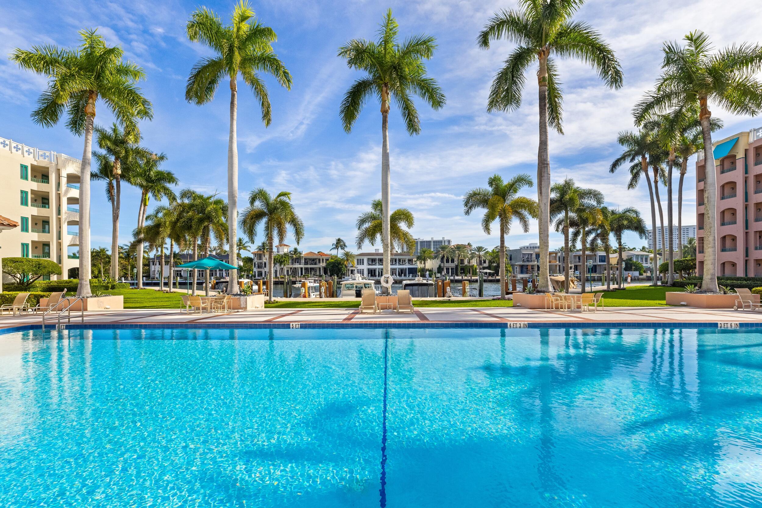 100 Southeast 5th Avenue, Unit 207 Boca Raton, FL 33432 - Photo 39 of 46 a view of swimming pool with outdoor seating and a garden