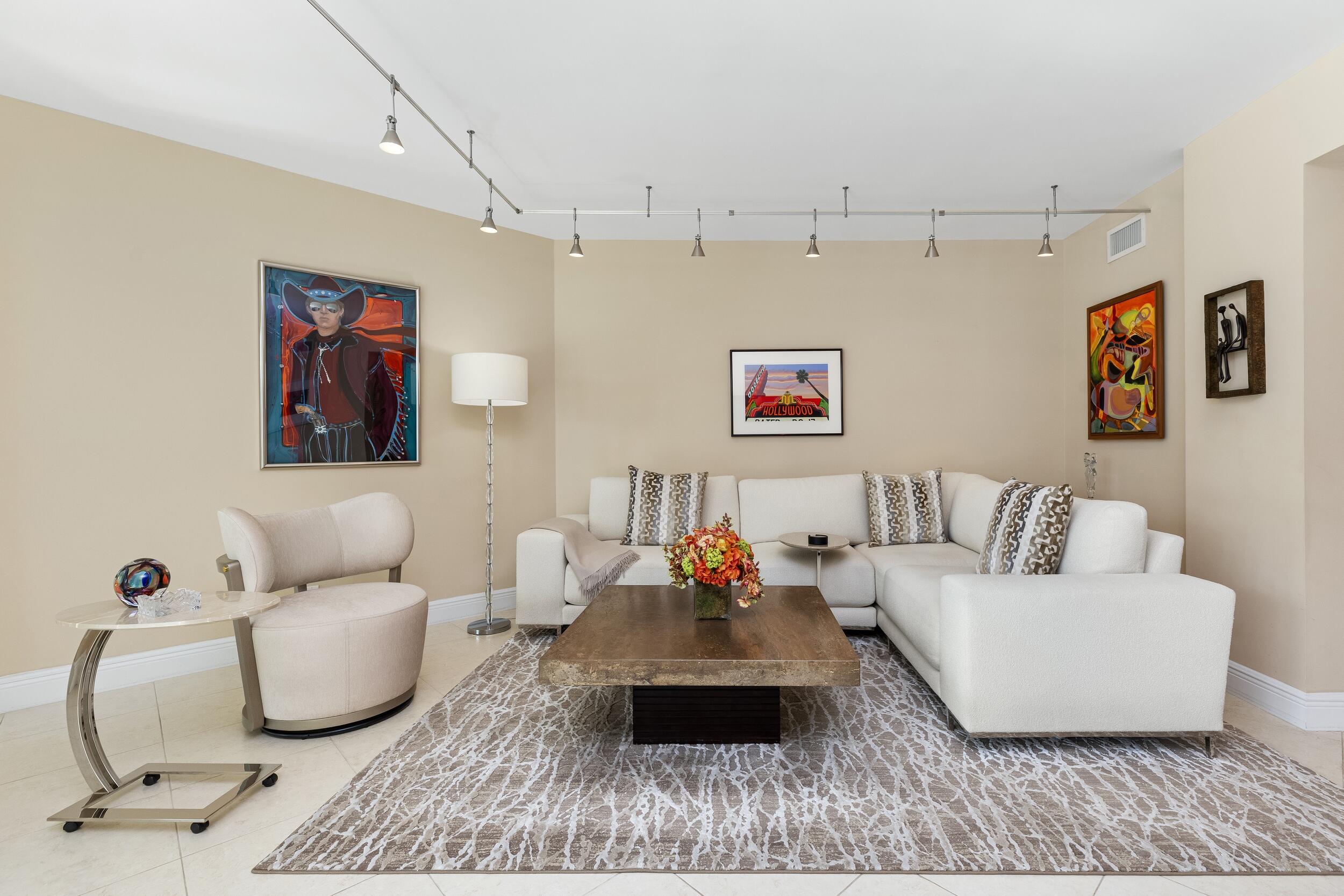 100 Southeast 5th Avenue, Unit 207 Boca Raton, FL 33432 - Photo 5 of 46 a living room with furniture and a couch