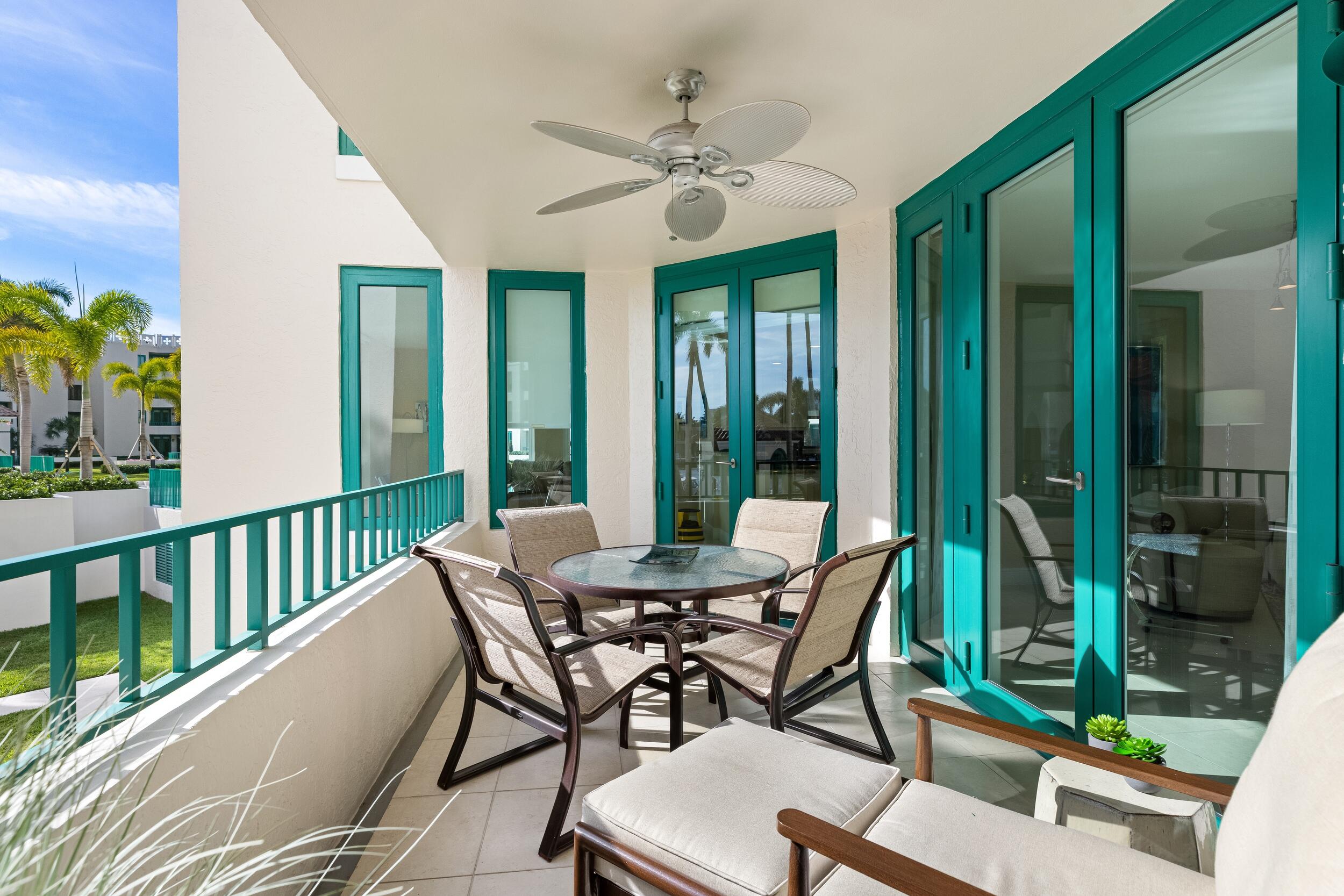 100 Southeast 5th Avenue, Unit 207 Boca Raton, FL 33432 - Photo 7 of 46 a view of a patio with a table and chairs