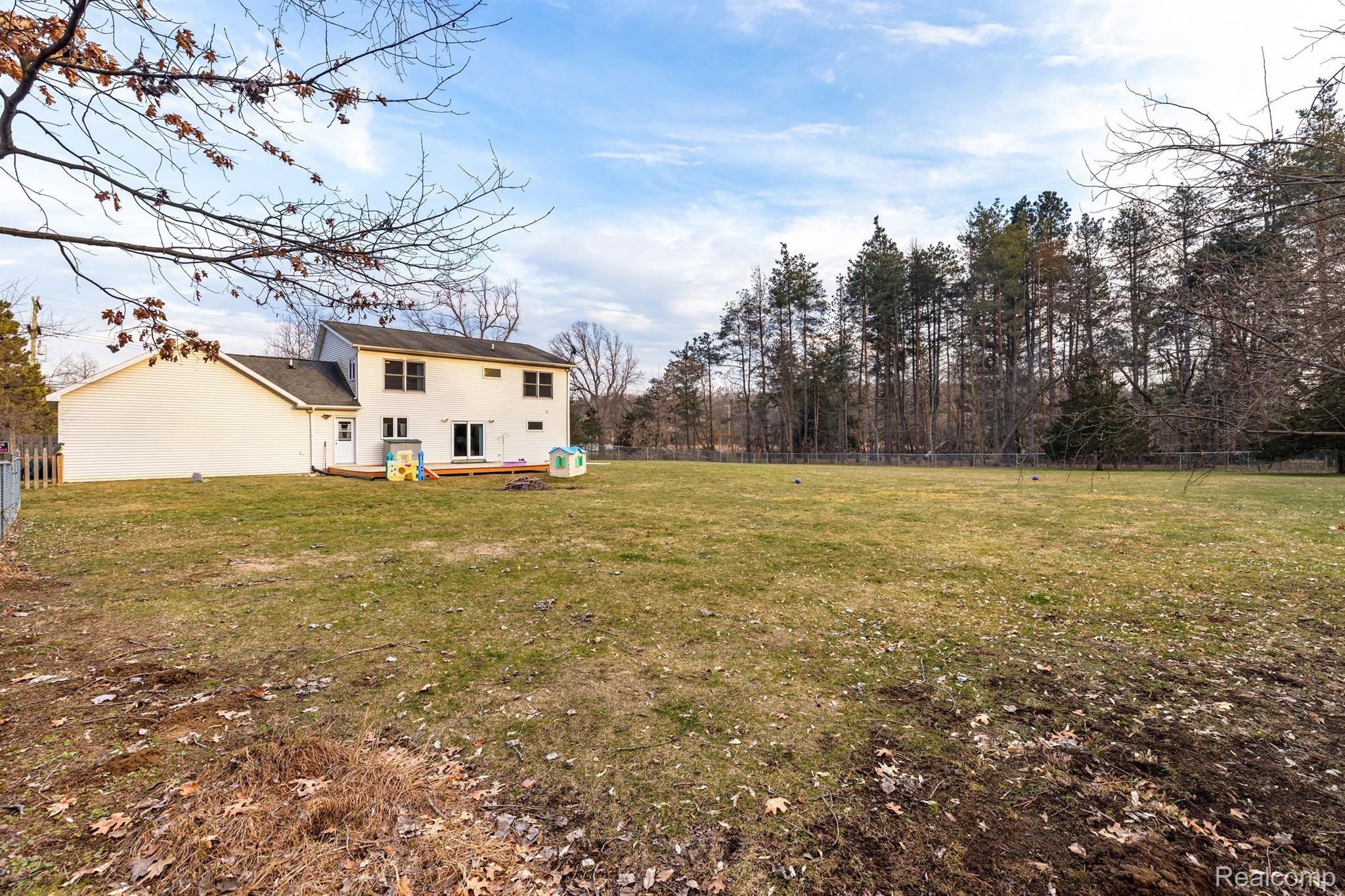 2741 Wixom Road Milford, MI 48381 - Photo 28 of 32 Back View w/plenty of space for a pole barn