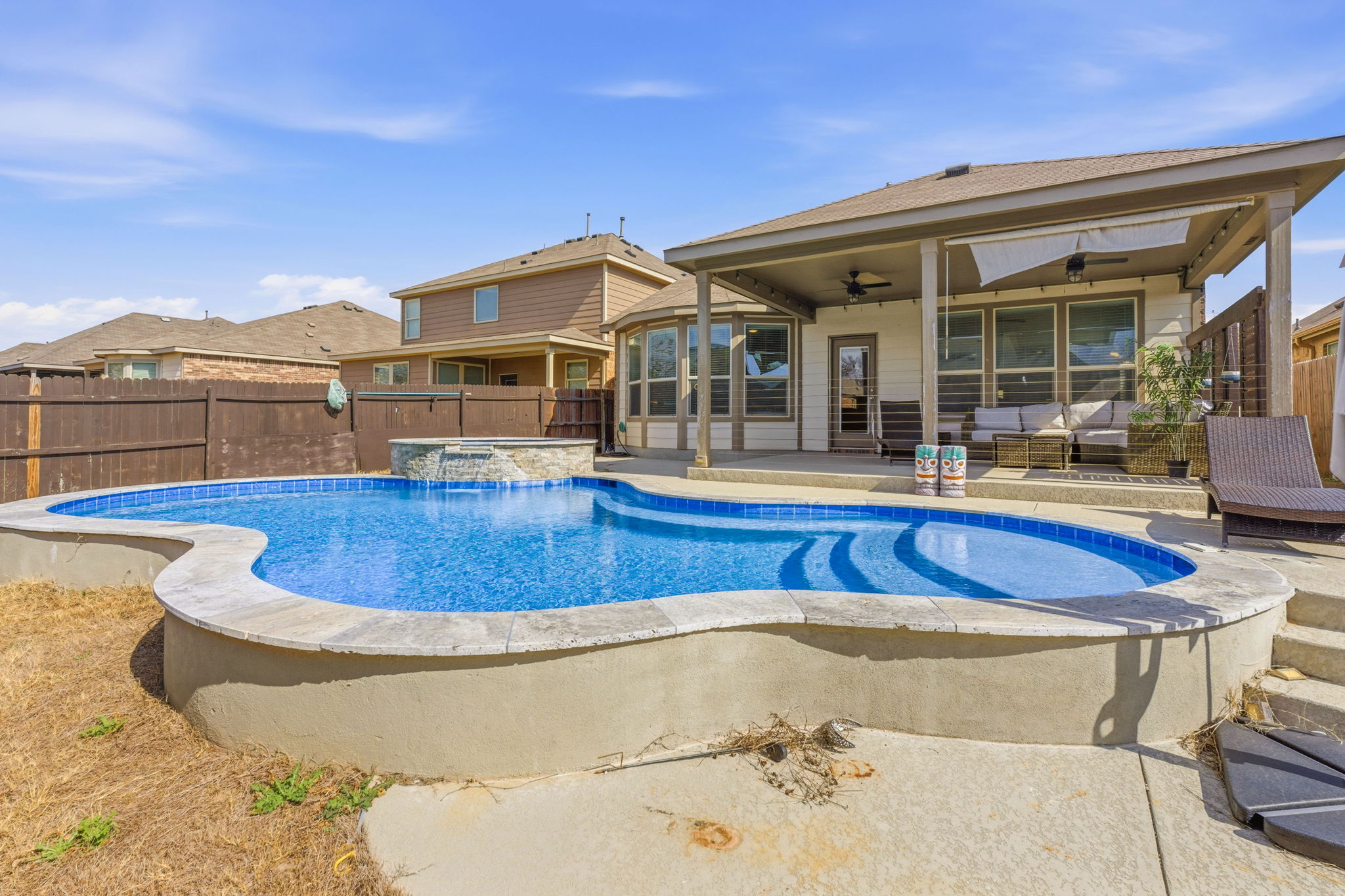 117 Methodius Drive Hutto, TX 78634 - Photo 1 of 40 View of pool with a fenced backyard, patio surround, an in-ground hot tub, and outdoor lounge area