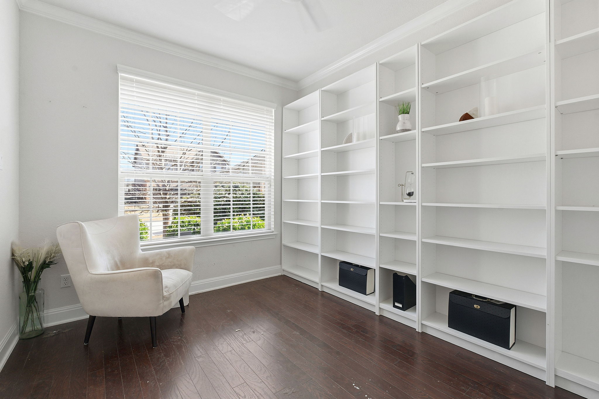 117 Methodius Drive Hutto, TX 78634 - Photo 12 of 40 Unfurnished room with dark wood-type flooring and crown molding