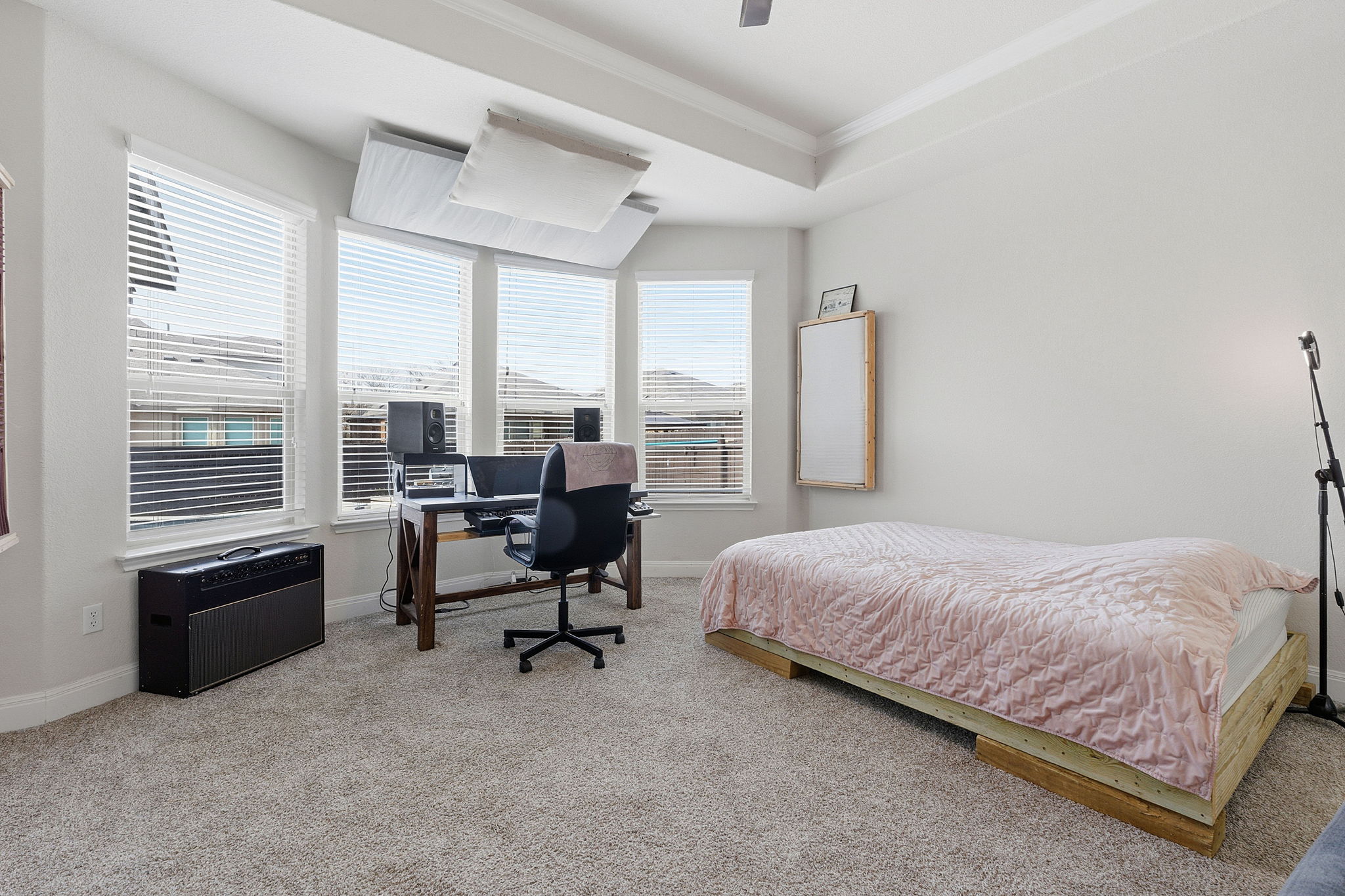 117 Methodius Drive Hutto, TX 78634 - Photo 13 of 40 Bedroom featuring an office area, light carpet, ornamental molding, and ceiling fan