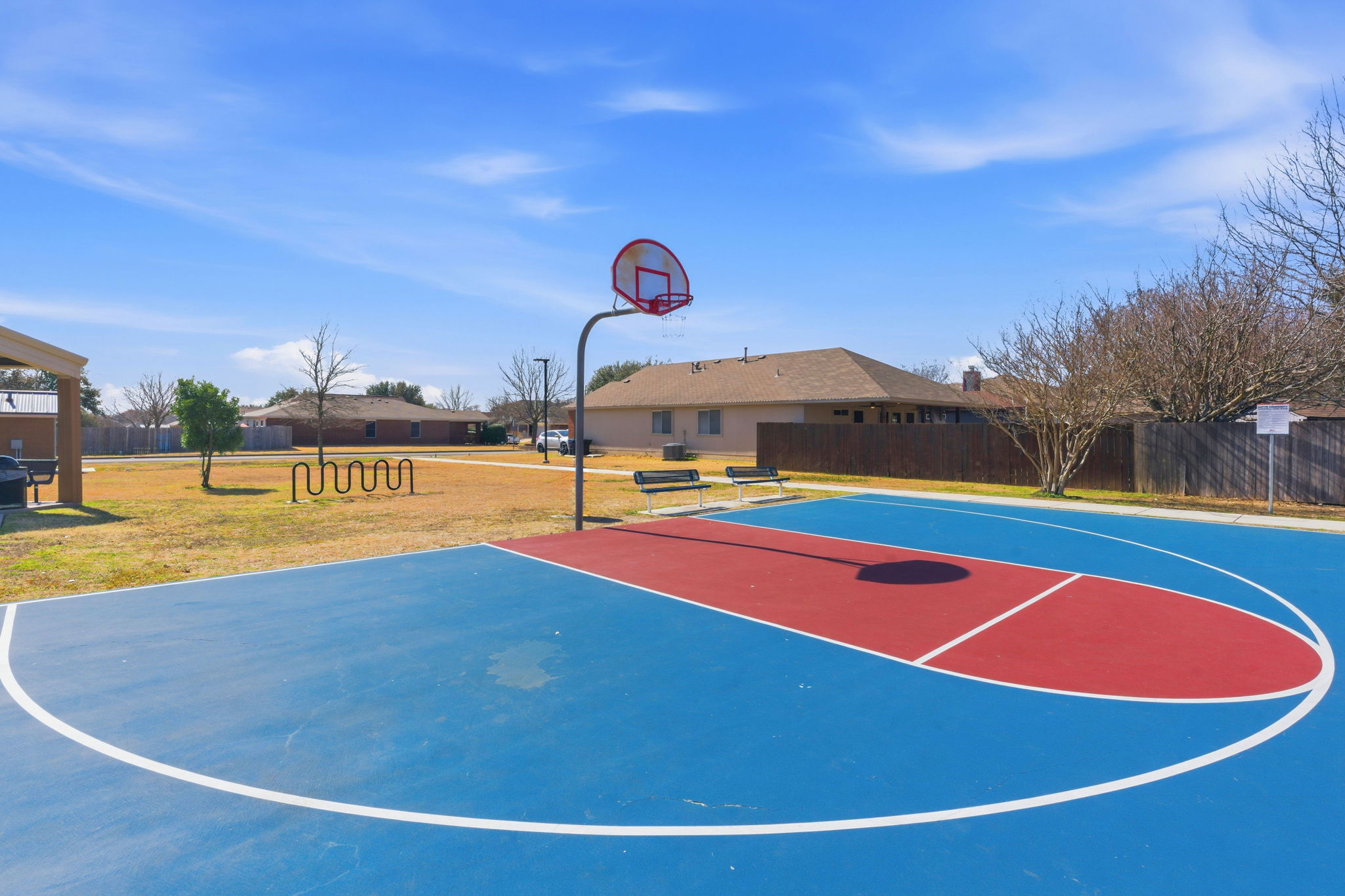 117 Methodius Drive Hutto, TX 78634 - Photo 37 of 40 View of basketball court with community basketball court and a residential view