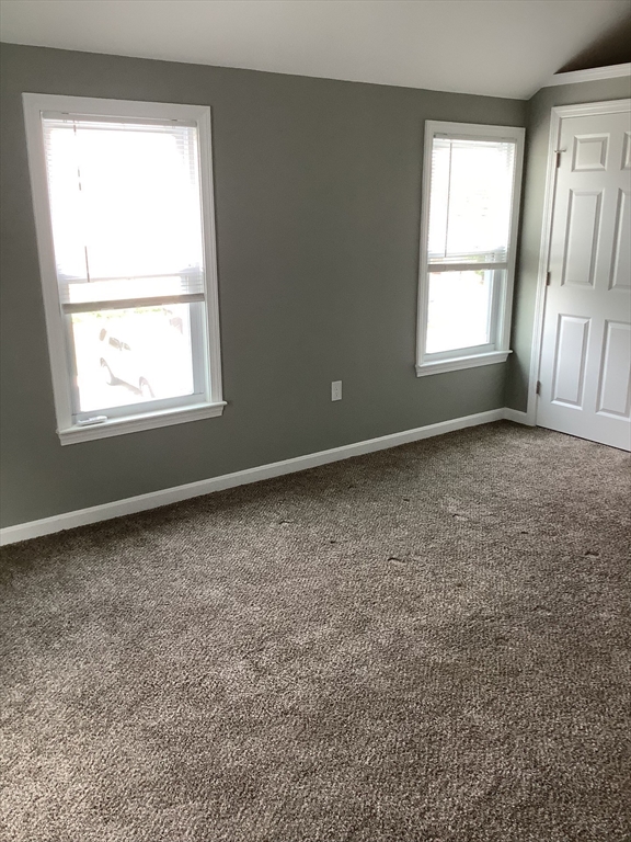 10 Moulton Court, Unit 10 Beverly, MA 01915 - Photo 11 of 21 an empty room with a window
