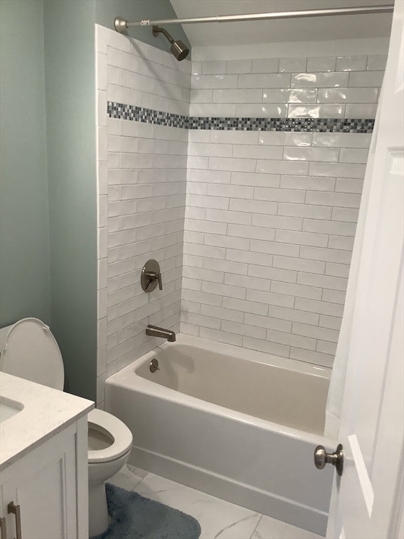 10 Moulton Court, Unit 10 Beverly, MA 01915 - Photo 12 of 21 a bathroom with a shower and a toilet