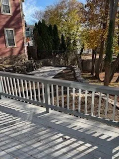 a view of a brick house with many windows