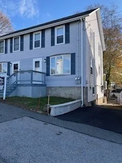 a brick building with a bench in front of it