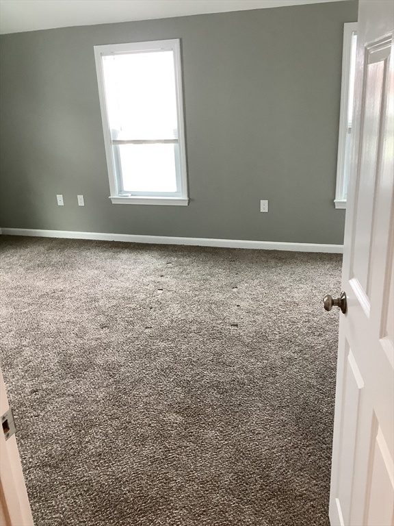 10 Moulton Court, Unit 10 Beverly, MA 01915 - Photo 10 of 21 an empty room with a window