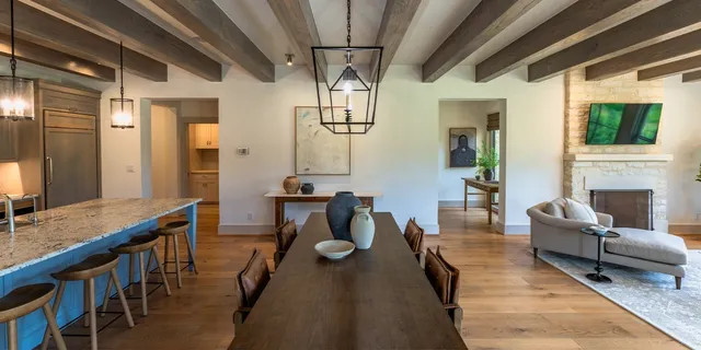 a living room with furniture a window and a table