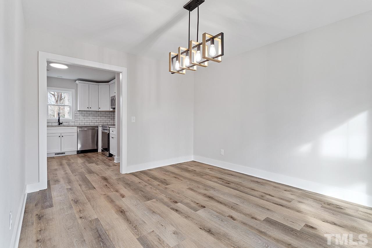 8205 Rocky Court Raleigh, NC 27616 - Photo 16 of 28 a view of a kitchen with wooden floor and a sink