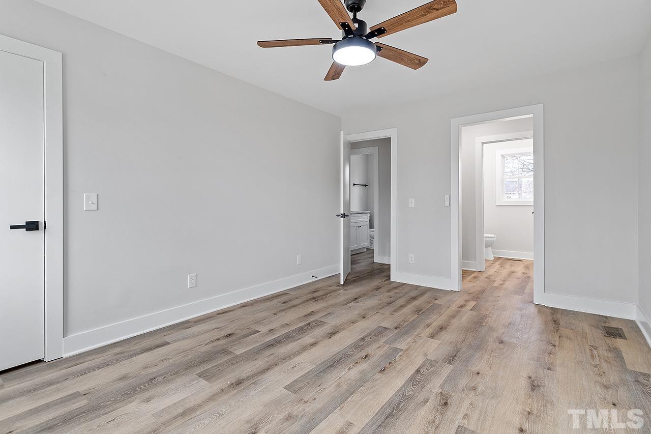 8205 Rocky Court Raleigh, NC 27616 - Photo 25 of 28 a view of empty room with wooden floor