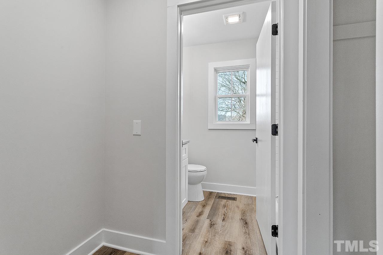 8205 Rocky Court Raleigh, NC 27616 - Photo 26 of 28 a view of room with window and hardwood floor