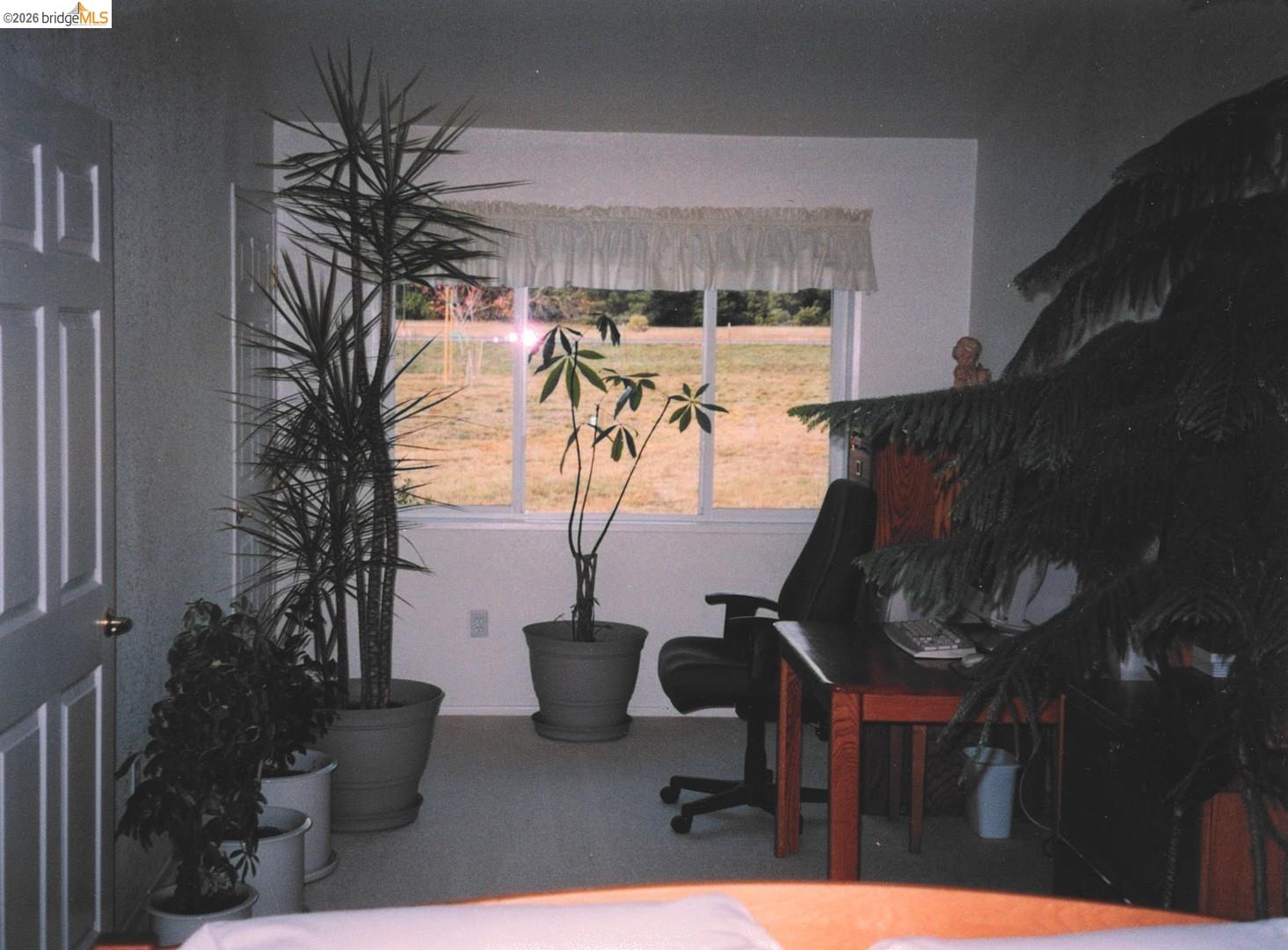 4001 Branscomb Road Laytonville, CA 95454 - Photo 15 of 28 a view of a patio with table and chairs potted plants